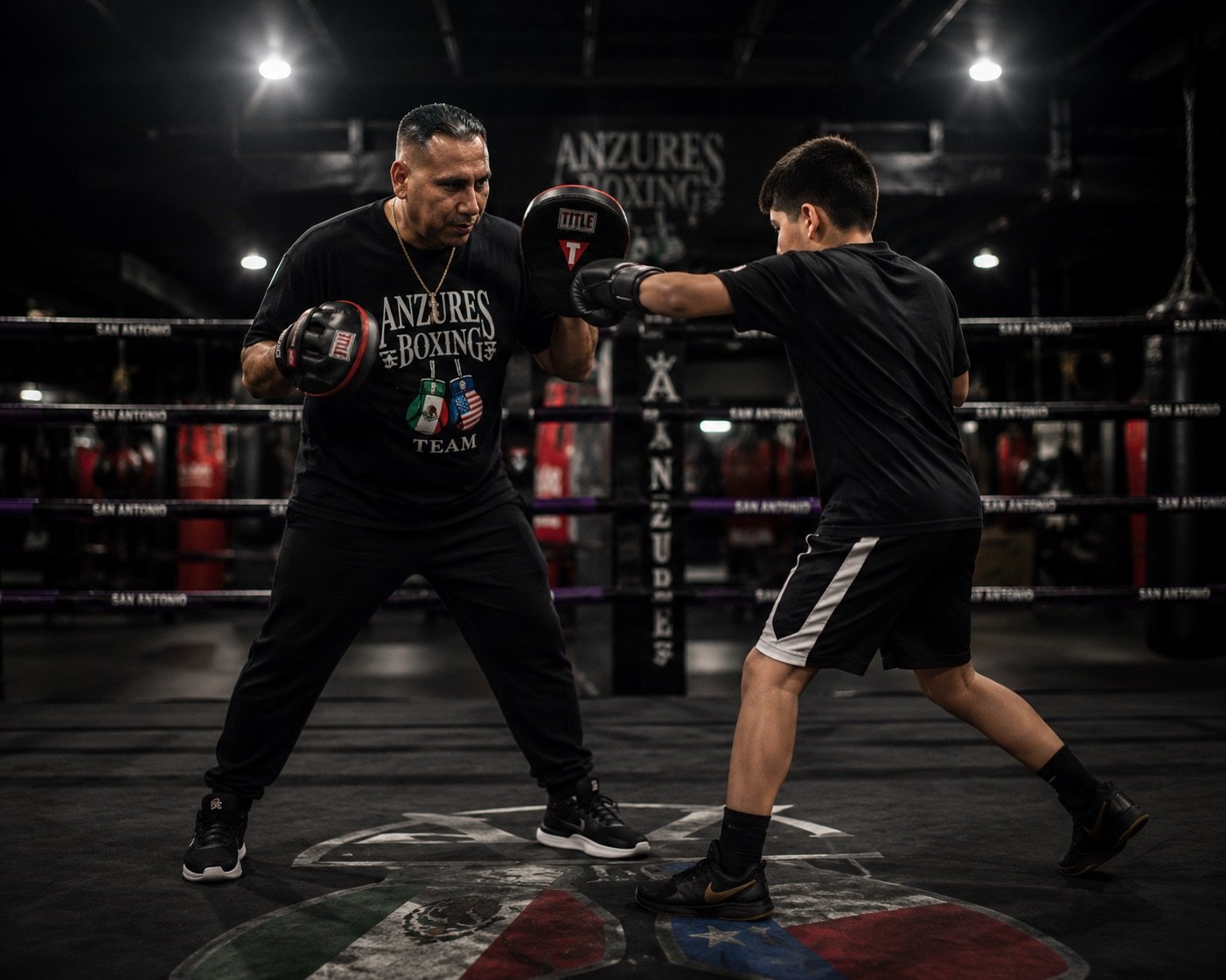 Coach training young boxer at Anzures Boxing Team, San Antonio